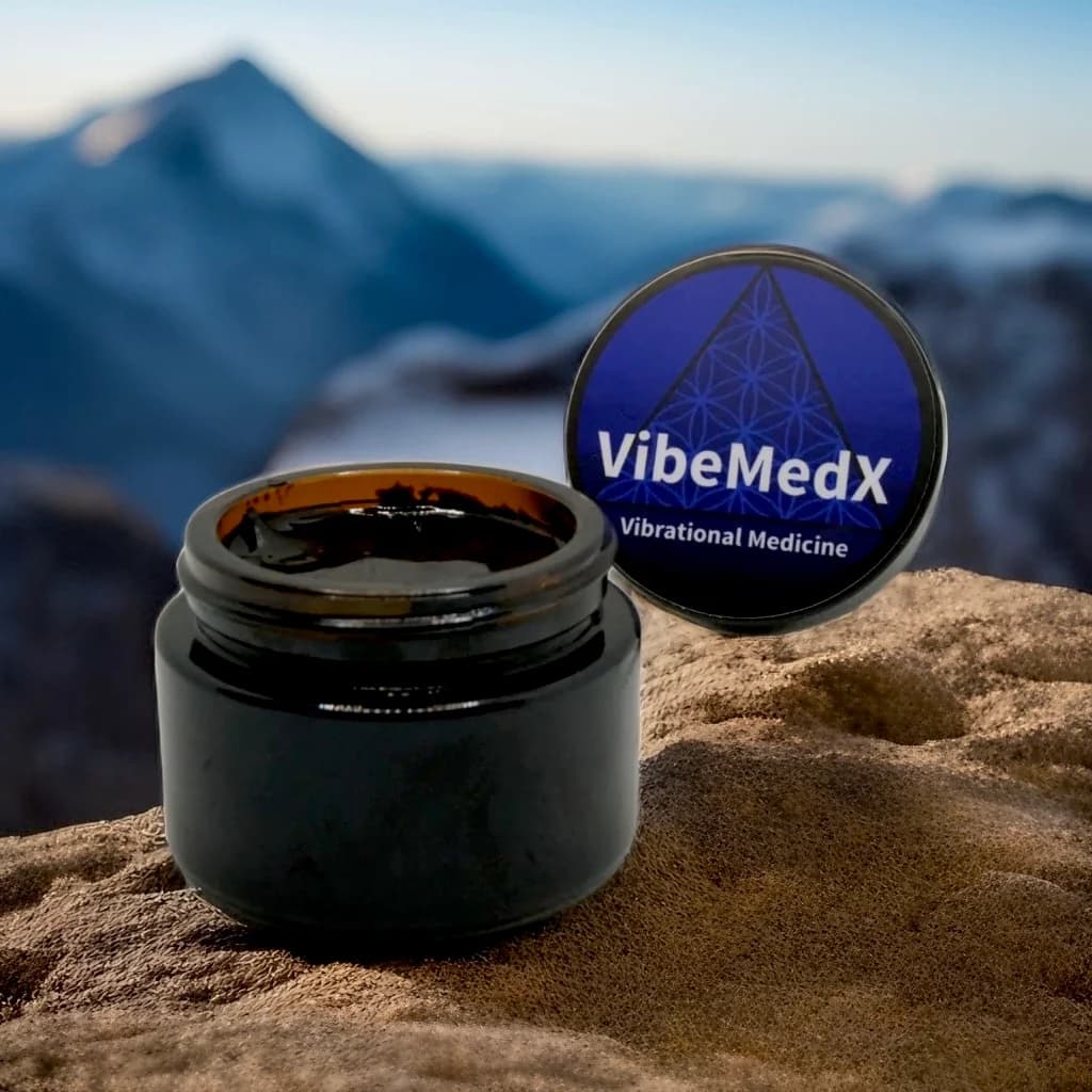Open VibeMedX shilajit resin jar on mountain rock at first light